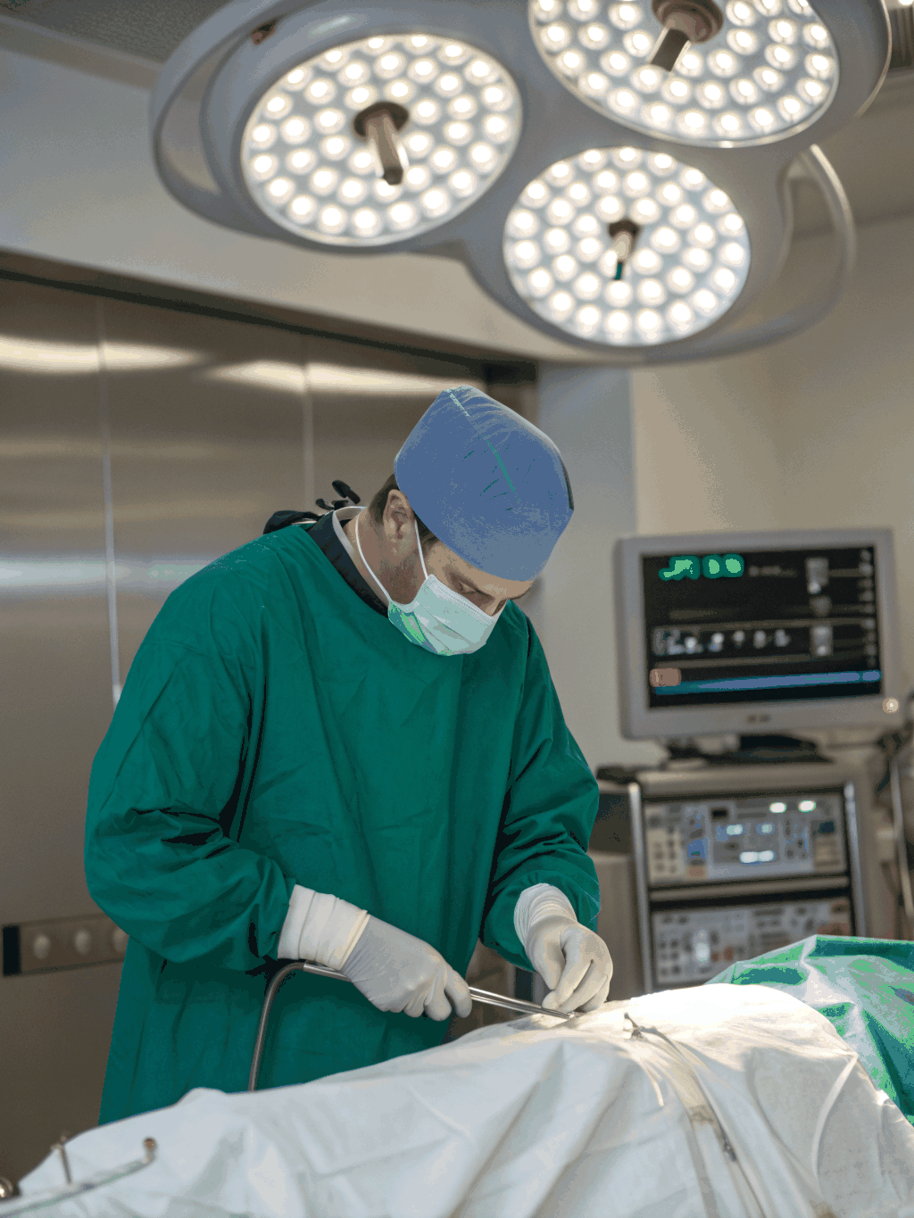 Surgeon performing arthroscopic surgery with surgical mask and instruments in the operating room